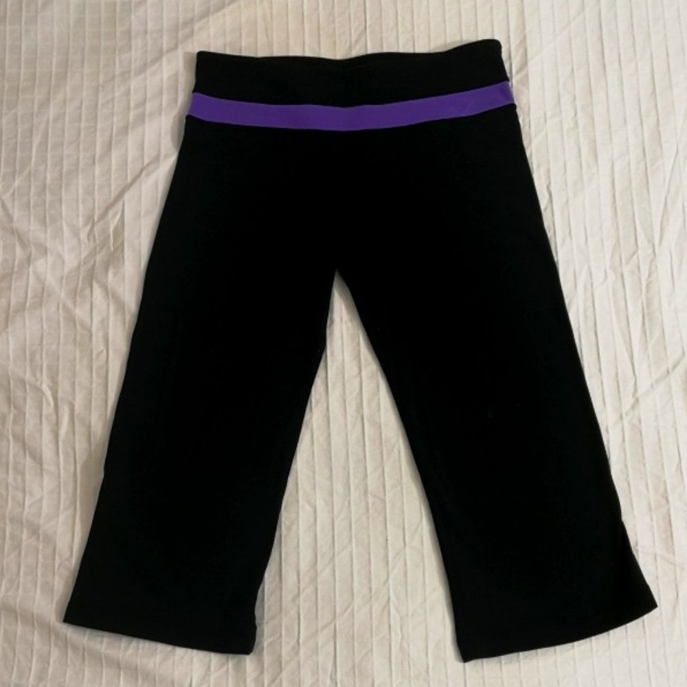 Lululemon black capri pants with purple waist band. Size small.
